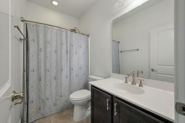 bathroom featuring vanity, a shower with curtain, tile patterned floors, and toilet