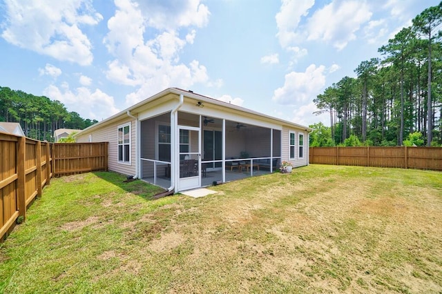 1250 Hammrick Ln, Johns Island, SC 29455 - rear view of house with ceiling fan, a sunroom, and a fenced backyard