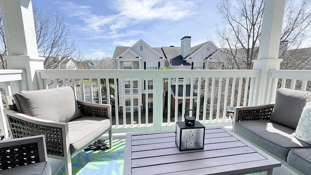 balcony featuring outdoor lounge area and a residential view