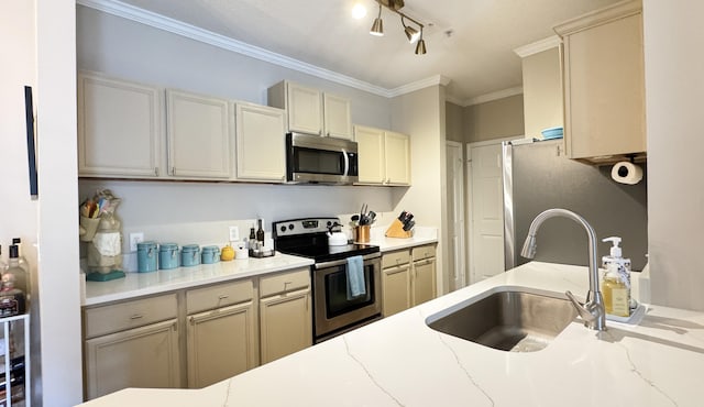 kitchen featuring light stone countertops, crown molding, appliances with stainless steel finishes, and a sink