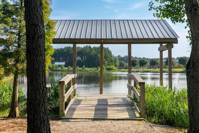 view of dock featuring a gazebo and a water view