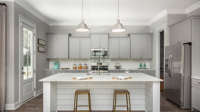 kitchen featuring gray cabinets, sink, stainless steel appliances, light stone countertops, and dark wood-type flooring