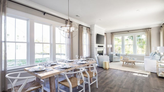 dining room featuring crown molding, an inviting chandelier, and dark wood-type flooring