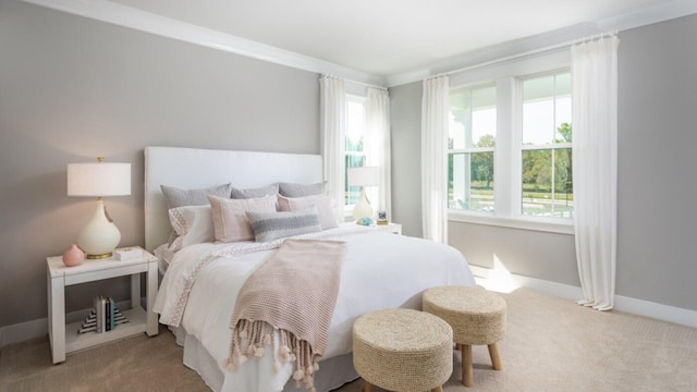 carpeted bedroom featuring multiple windows and crown molding