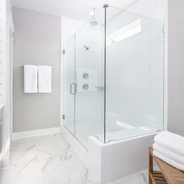 bathroom featuring vanity and an enclosed shower