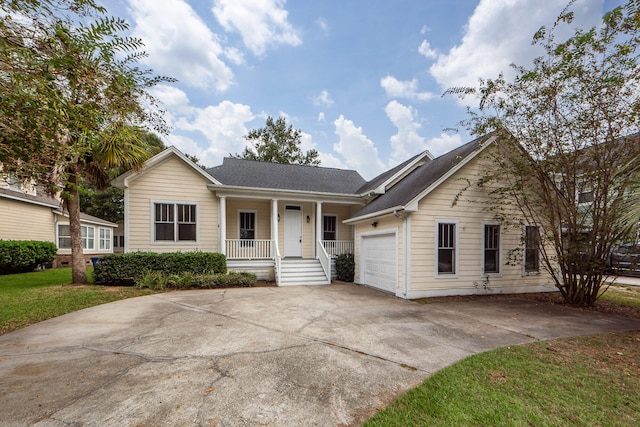 ranch-style home featuring a garage and a porch