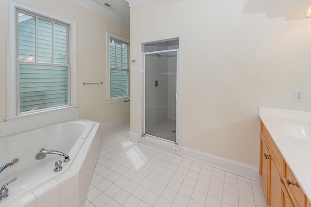 bathroom with tile patterned flooring, crown molding, shower with separate bathtub, and vanity