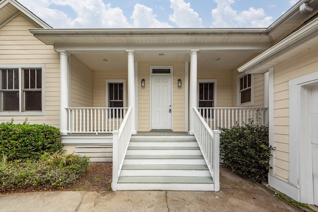 doorway to property featuring covered porch