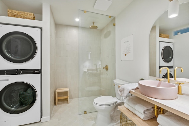 1815 Long Bend Dr, Seabrook Island, SC 29455 - full bathroom with stacked washer / dryer, a tile shower, toilet, and vanity