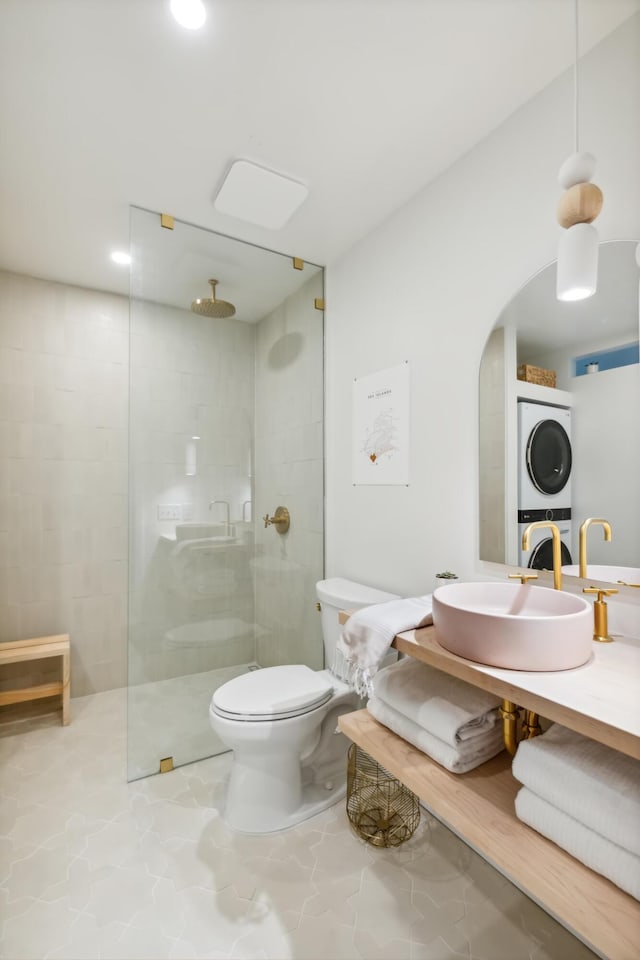 1815 Long Bend Dr, Seabrook Island, SC 29455 - full bath with stacked washing machine and dryer, a walk in shower, toilet, and vanity