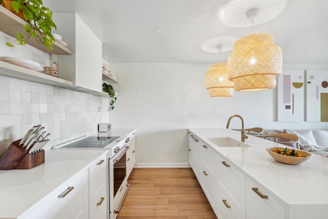 1815 Long Bend Dr, Seabrook Island, SC 29455 - kitchen with open shelves, high end white range oven, a sink, light wood finished floors, and white cabinets