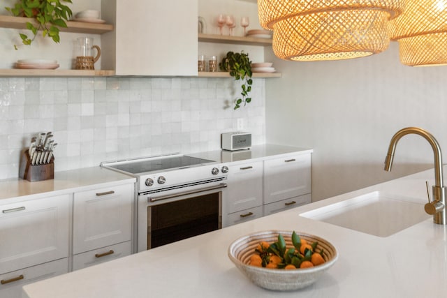 1815 Long Bend Dr, Seabrook Island, SC 29455 - kitchen featuring open shelves, electric range, a sink, and light countertops