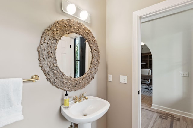 bathroom with sink and hardwood / wood-style floors