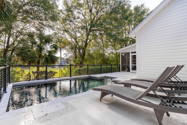 view of pool featuring a patio and a sunroom