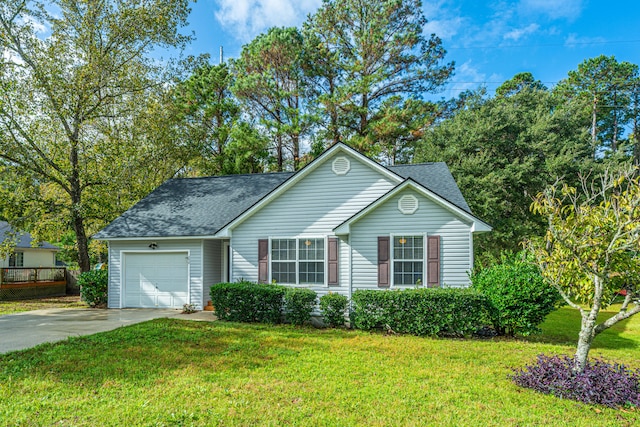 view of front of house featuring a garage and a front yard