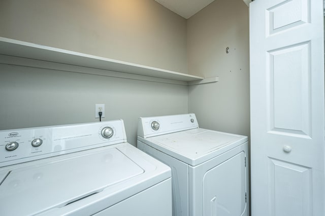 laundry area with separate washer and dryer