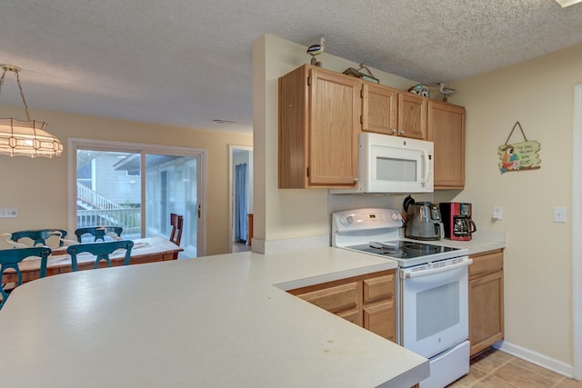 kitchen featuring light tile patterned flooring, a textured ceiling, light brown cabinets, pendant lighting, and white appliances