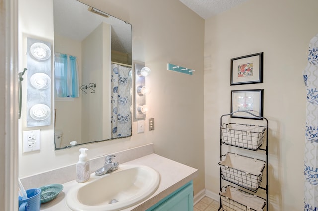 bathroom featuring vanity and a textured ceiling