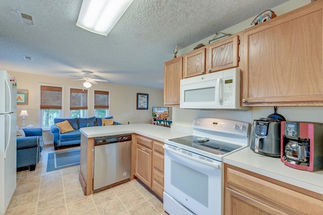 kitchen with kitchen peninsula, a textured ceiling, light brown cabinets, white appliances, and ceiling fan