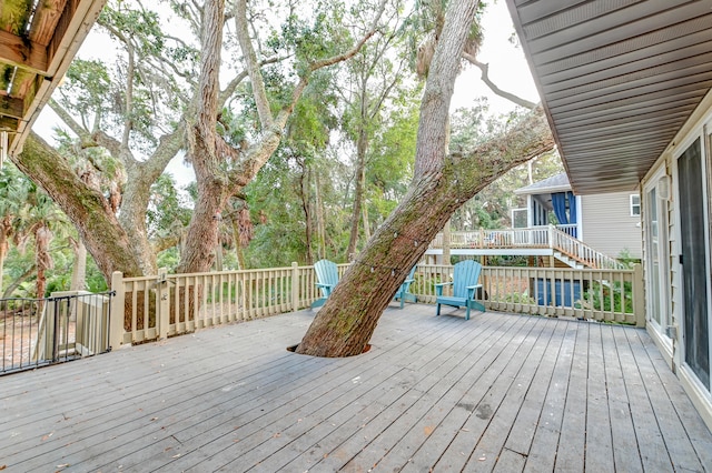 wooden deck with a sunroom