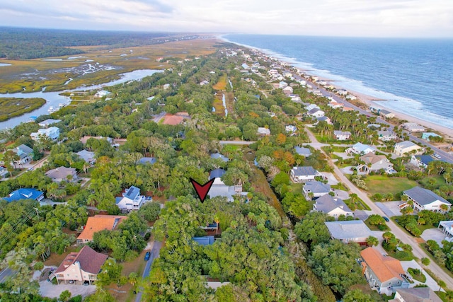 bird's eye view featuring a view of the beach and a water view