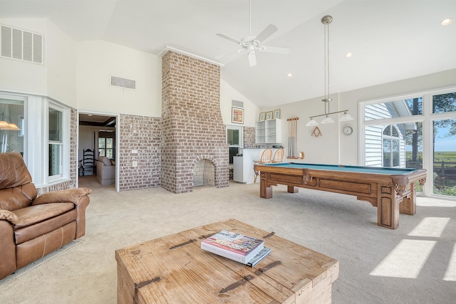 playroom featuring carpet floors, a brick fireplace, high vaulted ceiling, and visible vents