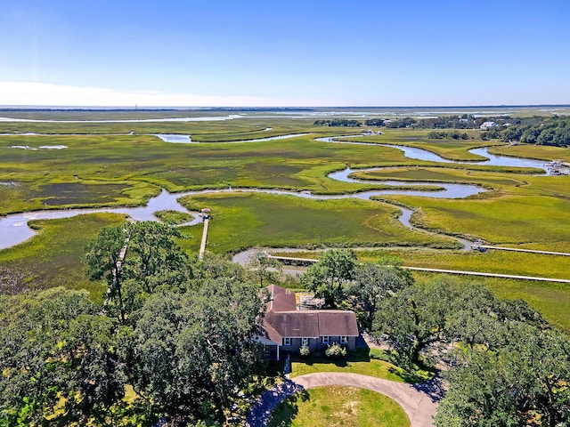 birds eye view of property featuring a water view and a rural view