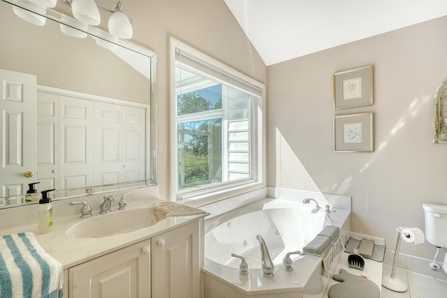 full bath featuring vaulted ceiling, a tub with jets, and vanity