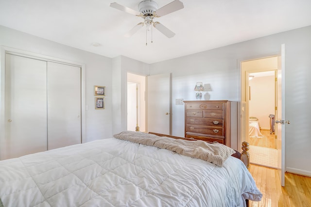 bedroom with a closet, connected bathroom, a ceiling fan, and light wood-style floors