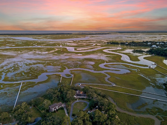 aerial view at dusk with a water view