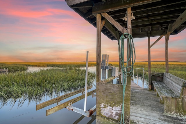 view of dock with a water view and boat lift