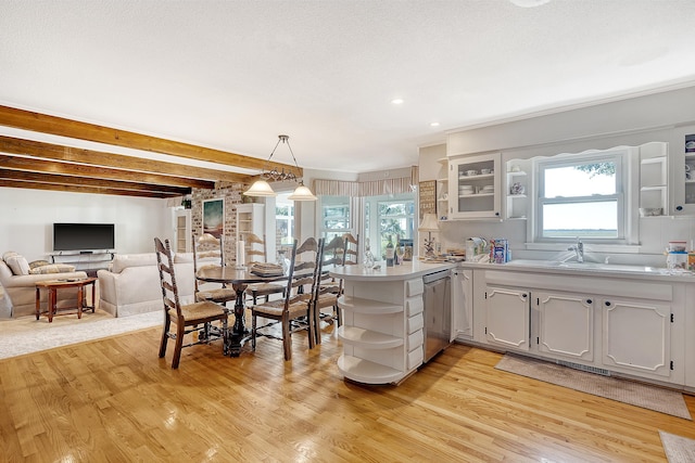 kitchen with a peninsula, light wood-style flooring, glass insert cabinets, and open shelves