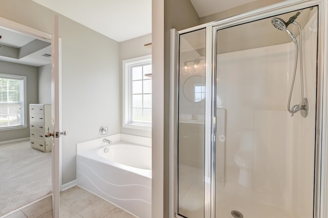 8038 Regency Elm Dr, North Charleston, SC 29406 - bathroom featuring plenty of natural light, a shower stall, a garden tub, and tile patterned floors