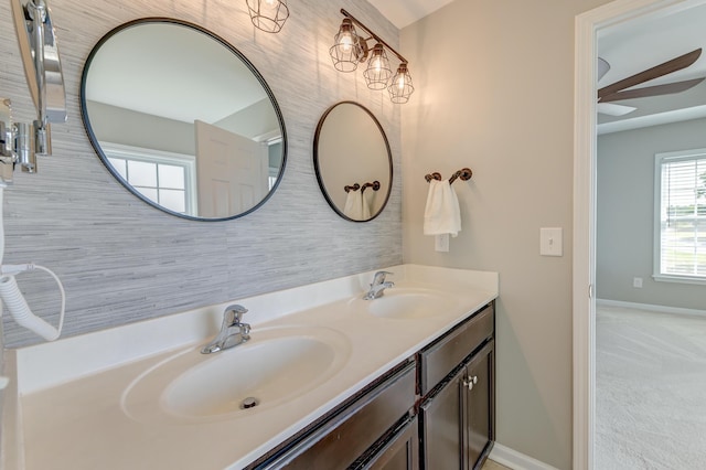 8038 Regency Elm Dr, North Charleston, SC 29406 - bathroom featuring double vanity, a ceiling fan, and baseboards