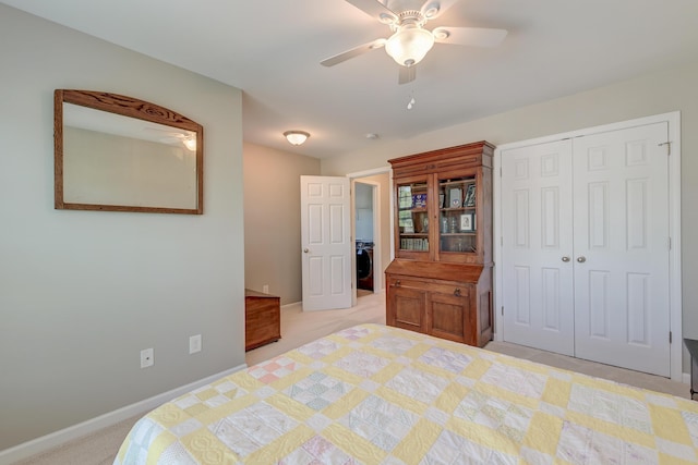 8038 Regency Elm Dr, North Charleston, SC 29406 - bedroom with a closet, washer / dryer, light colored carpet, baseboards, and a ceiling fan