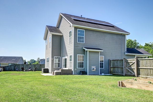 8038 Regency Elm Dr, North Charleston, SC 29406 - back of property with central AC, an outdoor living space, and a gate