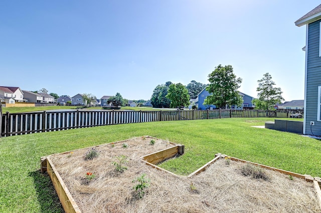 8038 Regency Elm Dr, North Charleston, SC 29406 - view of yard featuring a vegetable garden, a residential view, and a water view