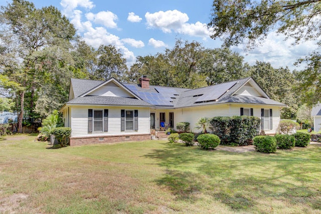 ranch-style home featuring a front lawn