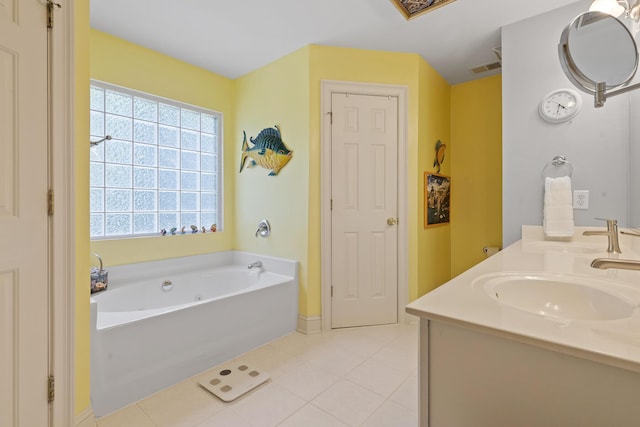 full bathroom featuring a bath, double vanity, a sink, and tile patterned flooring
