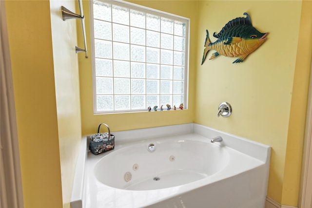 bathroom with a whirlpool tub