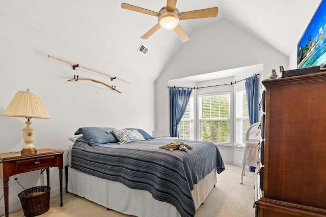 bedroom with ceiling fan, visible vents, light carpet, and vaulted ceiling