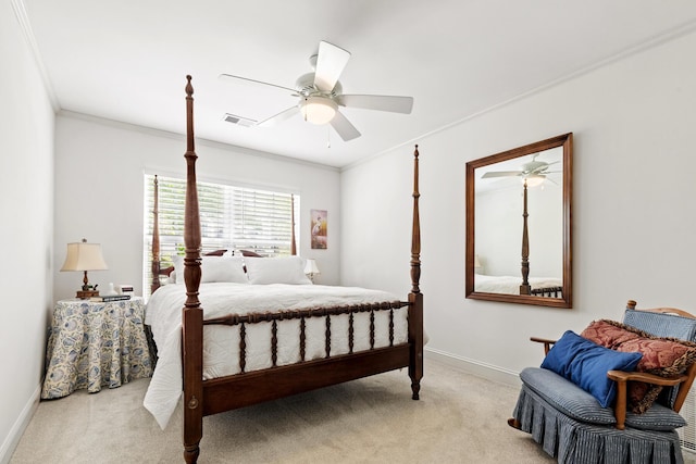 bedroom featuring carpet floors, ornamental molding, visible vents, baseboards, and ceiling fan