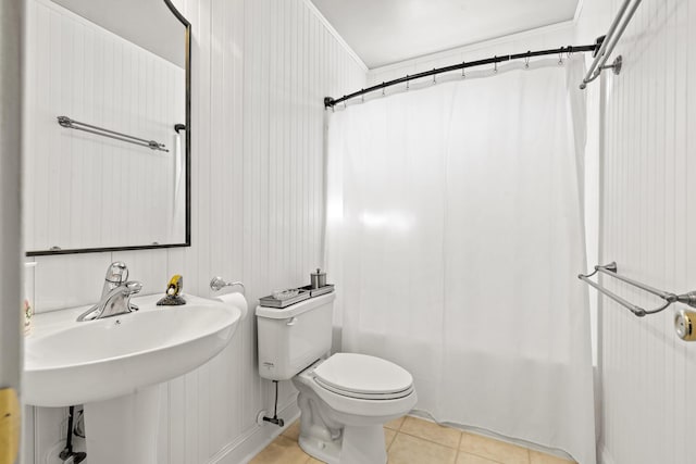 full bath with a sink, tile patterned flooring, toilet, and shower / bath combination with curtain