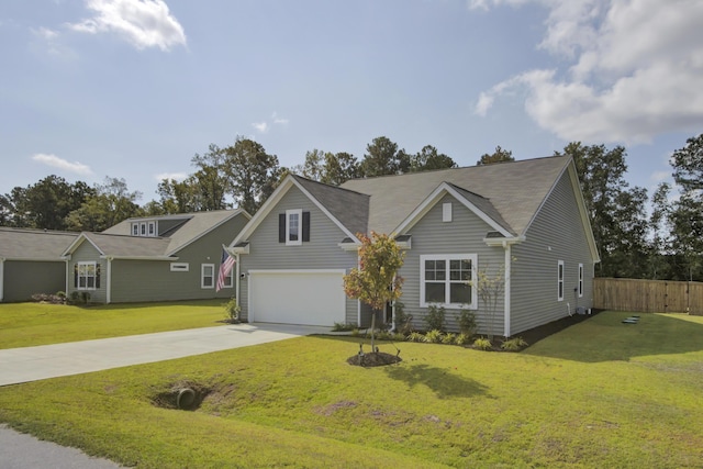 view of front of house featuring a front lawn and a garage