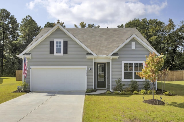 view of front facade with a front yard and a garage