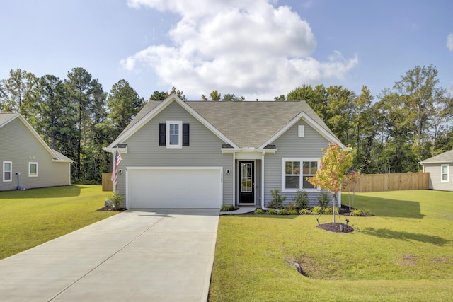 view of front of house with a front lawn and a garage