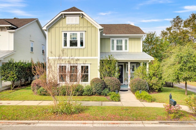 craftsman-style home with a front lawn