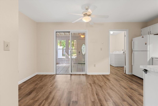 1383 Camp Rd Unit C, Charleston, SC 29412 - unfurnished dining area with light wood finished floors, washer and dryer, and a ceiling fan