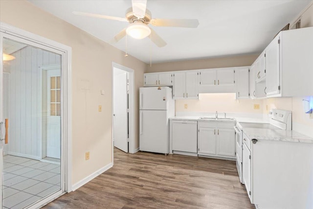 1383 Camp Rd Unit C, Charleston, SC 29412 - kitchen with white appliances, a ceiling fan, white cabinets, wood finished floors, and light countertops