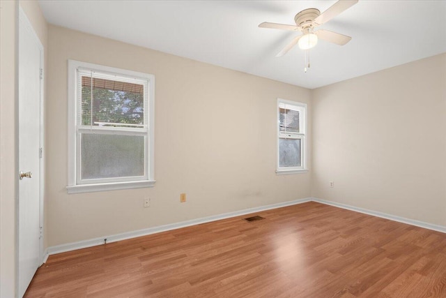 1383 Camp Rd Unit C, Charleston, SC 29412 - empty room with healthy amount of natural light, light wood finished floors, and ceiling fan